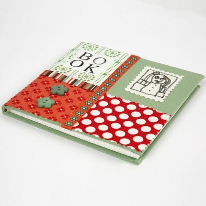 A Notebook covered with a Collage made from organic Cotton