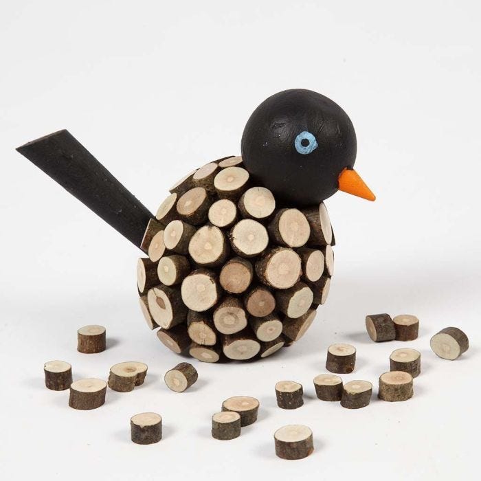 Houten vogel met kleine houten schijven