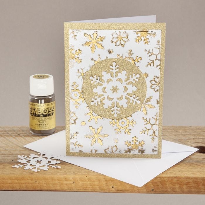 Kerstkaart met embossing en sneeuwvlok