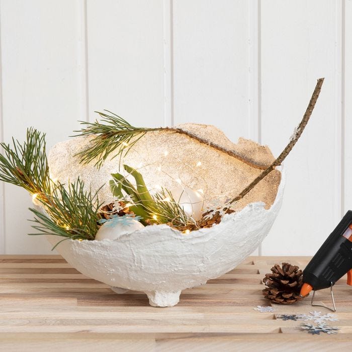 A Gauze Bandage Bowl with Glitter, decorated  with Glass Baubles, Cones etc.