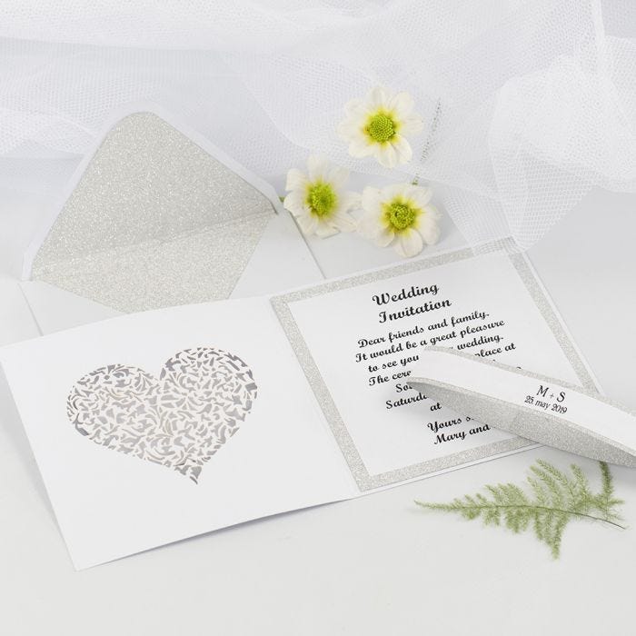 A Wedding Invitation and Envelope decorated with Design Paper