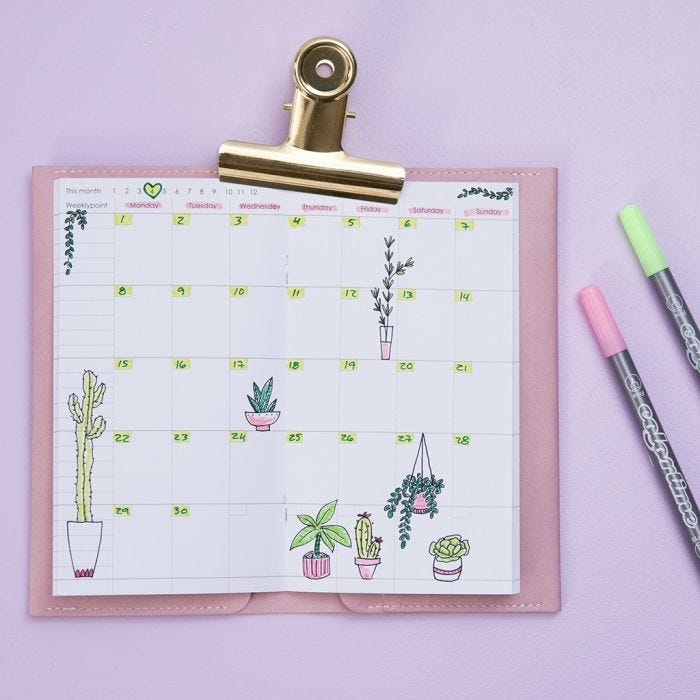 Gedecoreerde wekelijkse kalender voor een Bullet Journal