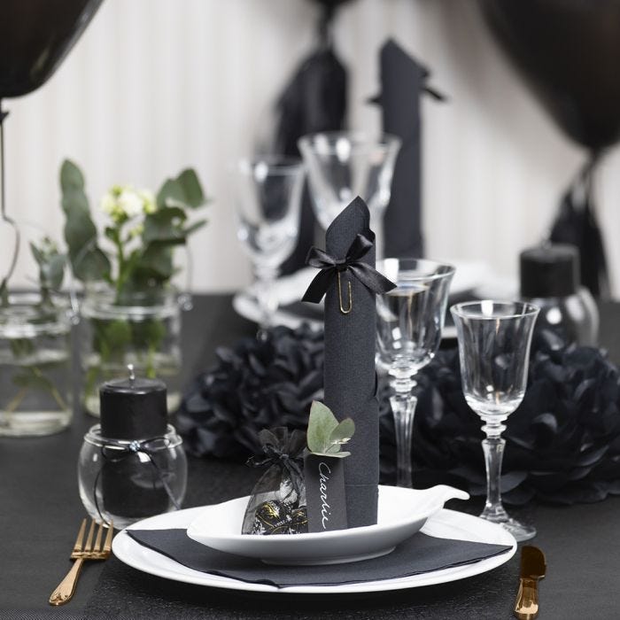 Black Table Decorations with Paper Flowers, Balloons, a Napkin folded like a Tower and Place Cards