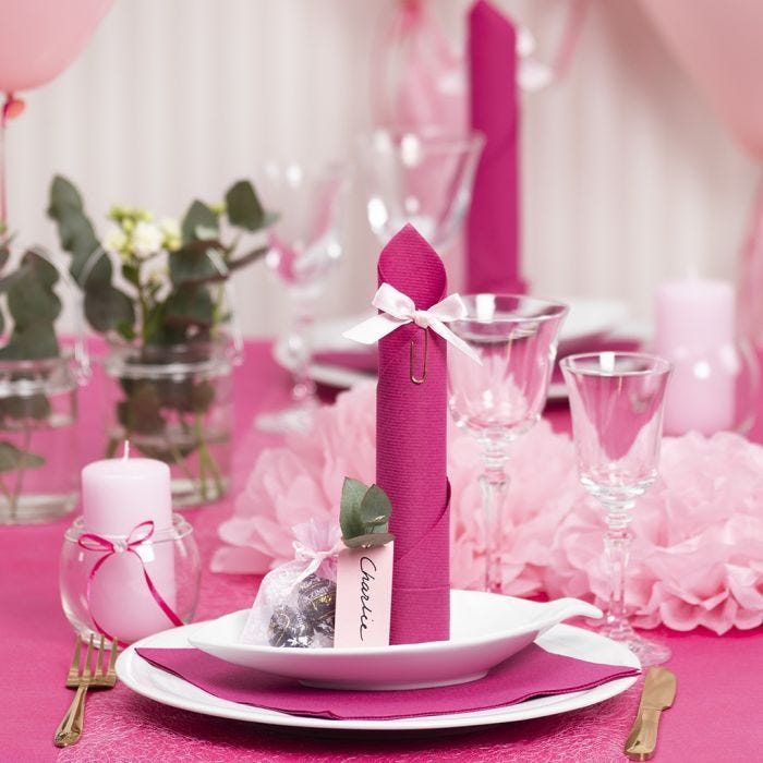 Light red Table Decorations with Paper Flowers, Balloons, a Napkin folded like a Tower and Place Cards