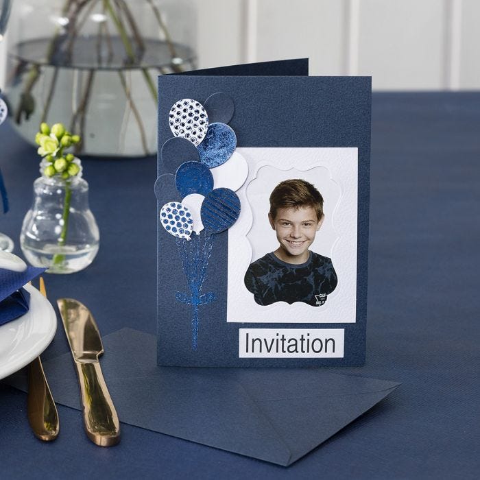 An Invitation with a Photo and punched-out Balloons decorated with Deco Foil