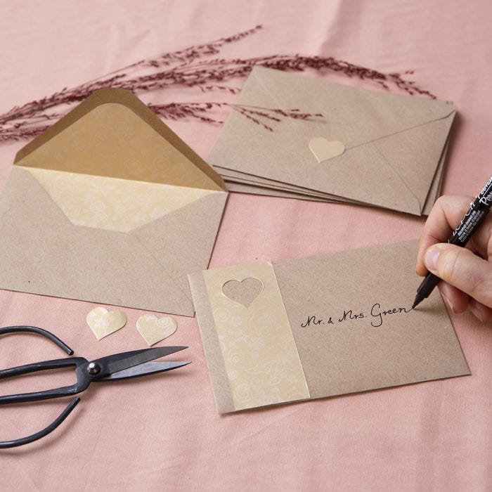 Envelopes from recycled paper decorated with gold paper