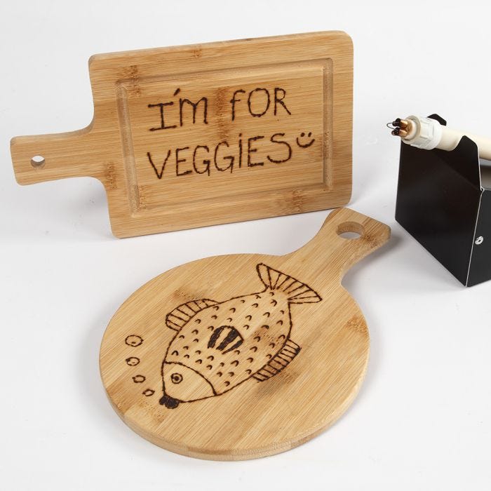 A bamboo chopping board decorated with a pyrography tool