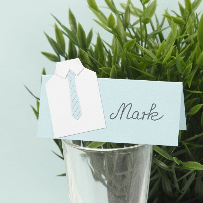 A place card for a confirmation party with a shirt from card and a paper tie