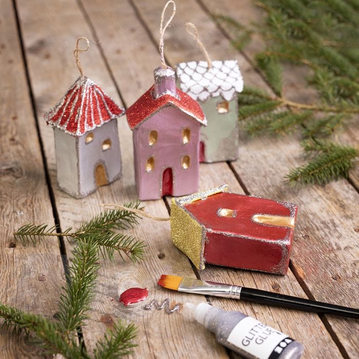 Christmas houses for hanging decorated with metallic paint and glitter