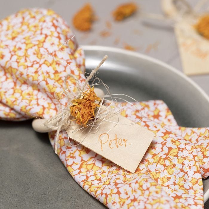 Napkins made from patchwork fabric and a napkin ring decorated with dried flowers