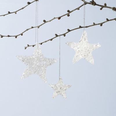 Glanzende ster hangende decoraties gemaakt van Sticky Base en glitter