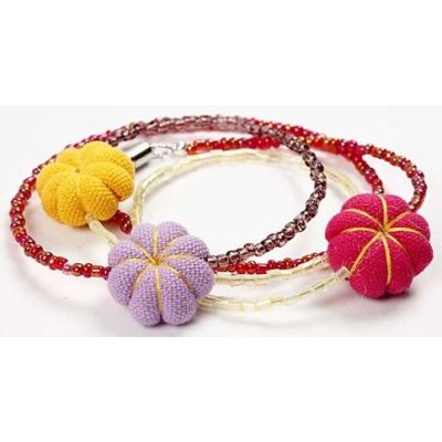 A Bracelet with Rocaille beads and Mini Fabric Pumpkins