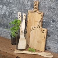 Bamboo kitchen utensils decorated with a pyrography tool