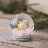 A snow globe with an angel made from Fimo